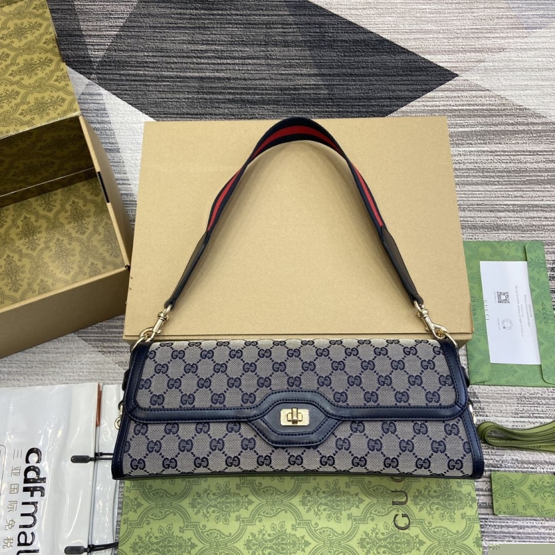 G*u*i top handle bags